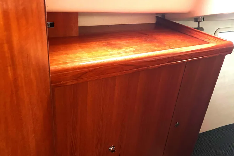 Slide: The Image of Wooden interior cabinet on a 2005 Hunter 33 sailboat. - 8