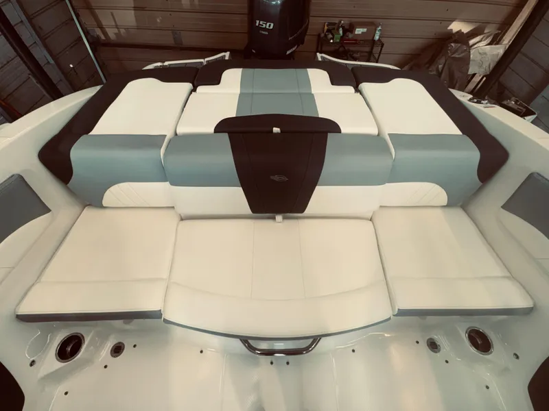 Slide: The Image of 2023 Chaparral 21 SSi OB boat interior with cushioned seating and modern design. - 12