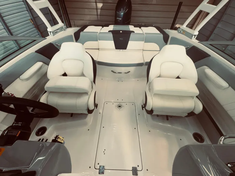 Slide: The Image of 2023 Chaparral 21 SSi OB boat interior with white seating and modern design. - 15
