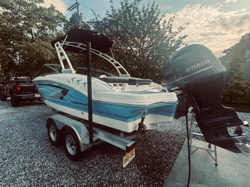 Slide: The Image of 2023 Chaparral 21 SSi OB boat with Yamaha outboard motor on a trailer. - 23