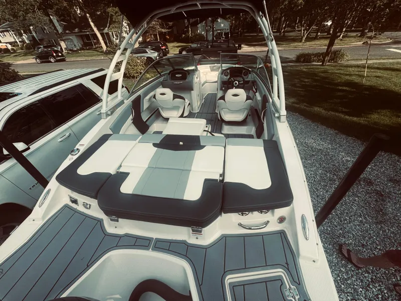 Slide: The Image of 2023 Chaparral 21 SSi OB boat with sleek interior design and seating arrangement. - 32