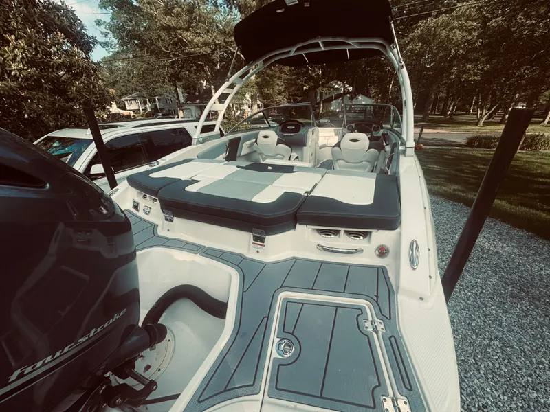 Slide: The Image of 2023 Chaparral 21 SSi OB boat with spacious seating and sleek design. - 33