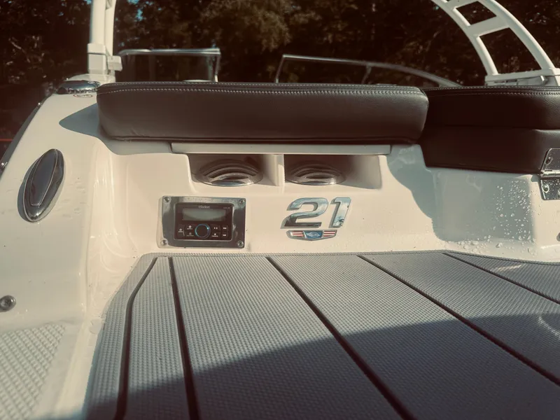 Slide: The Image of 2023 Chaparral 21 SSi OB boat interior with seating and audio system. - 35