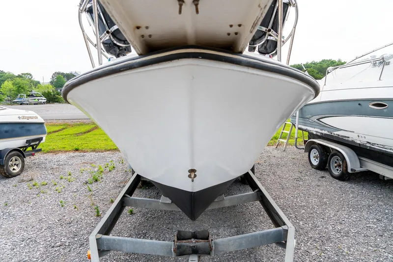 Slide: The Image of 1986 Aquasport 250 Express Fisherman boat on trailer, front view. - 14