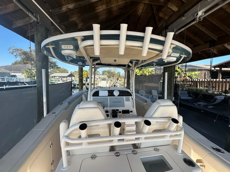 Slide: The Image of 2020 Grady-White Canyon 306 boat interior under a wooden shelter. - 14