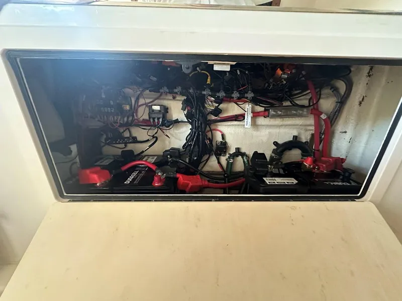 Slide: The Image of Electrical compartment of 2020 Grady-White Canyon 306 boat, showcasing wiring and components. - 15