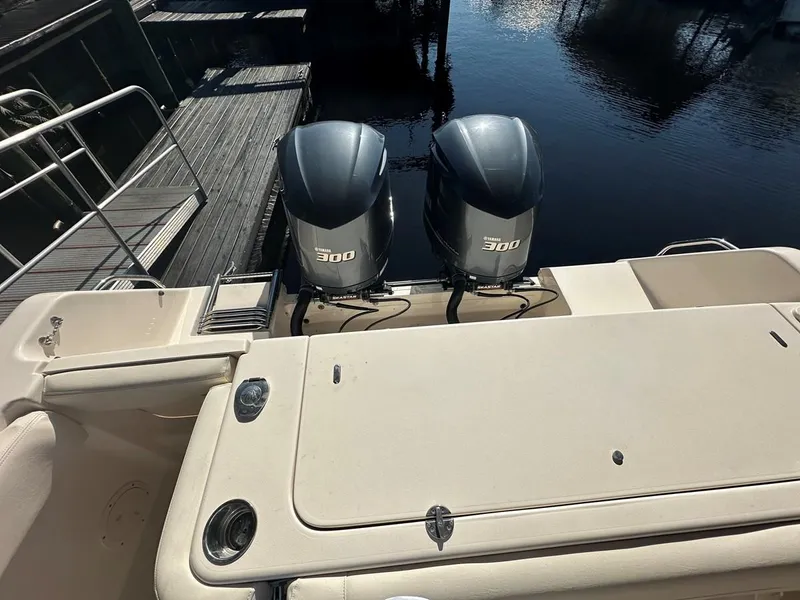 Slide: The Image of 2020 Grady-White Canyon 306 boat with twin 300 horsepower engines at dock. - 4