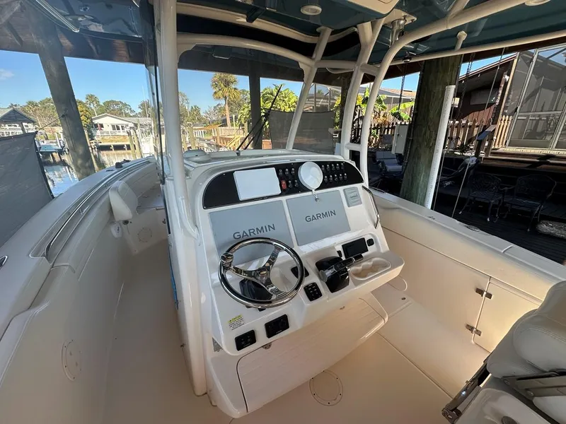 Slide: The Image of 2020 Grady-White Canyon 306 boat helm with Garmin navigation systems. - 5