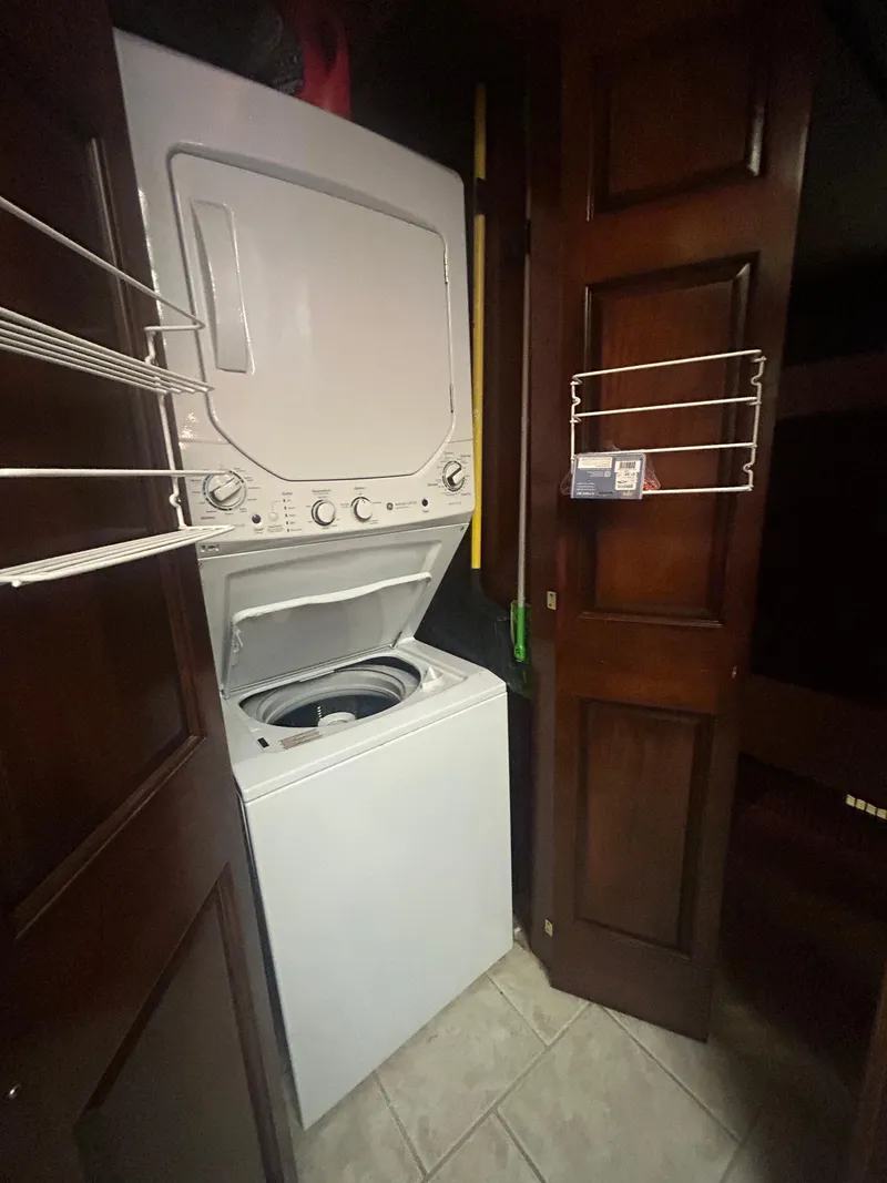 Slide: The Image of Stacked washer and dryer in 2001 Fantasy houseboat laundry area. - 14