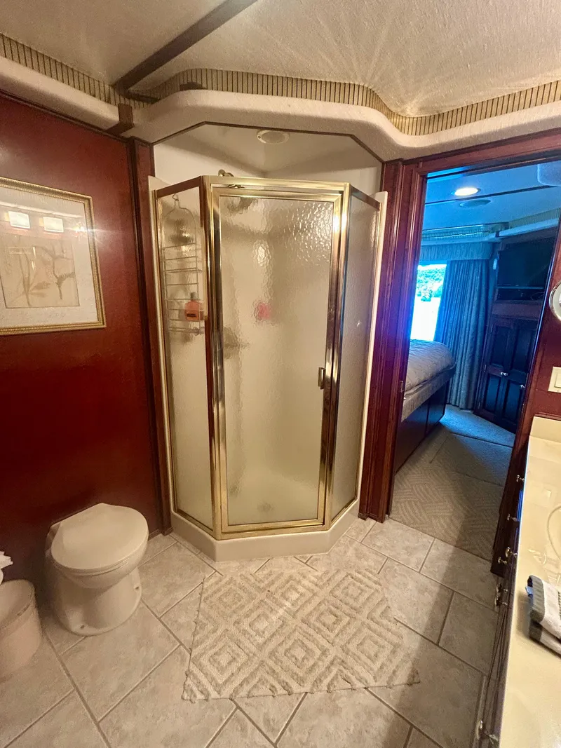Slide: The Image of Luxurious bathroom on a 2001 Fantasy houseboat with shower, toilet, and elegant decor. - 23
