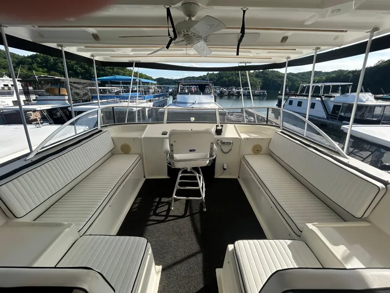 Slide: The Image of Spacious 2001 Fantasy houseboat deck with seating, overlooking a serene marina. - 29