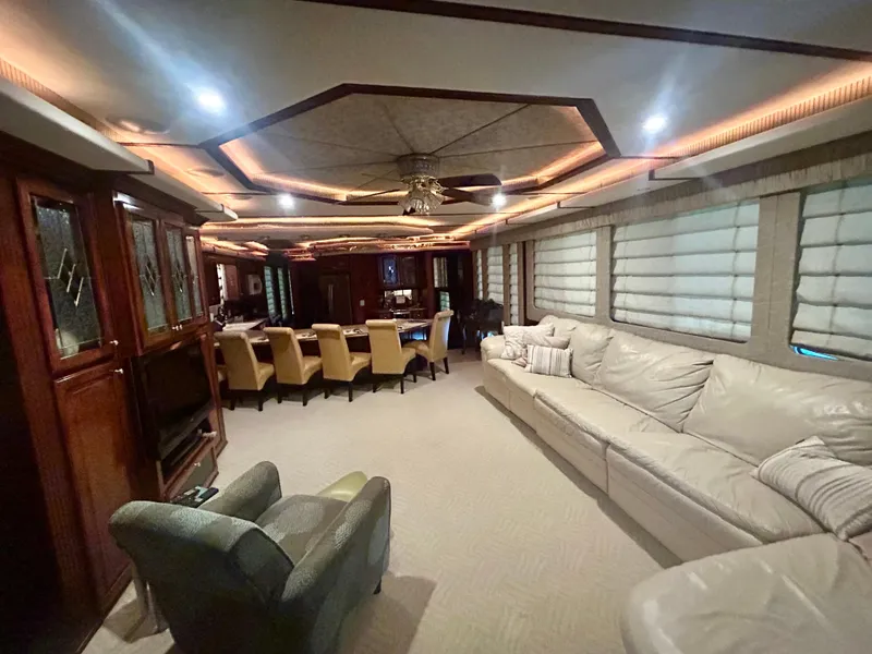 Slide: The Image of Luxurious interior of a 2001 Fantasy houseboat with elegant seating and ambient lighting. - 3