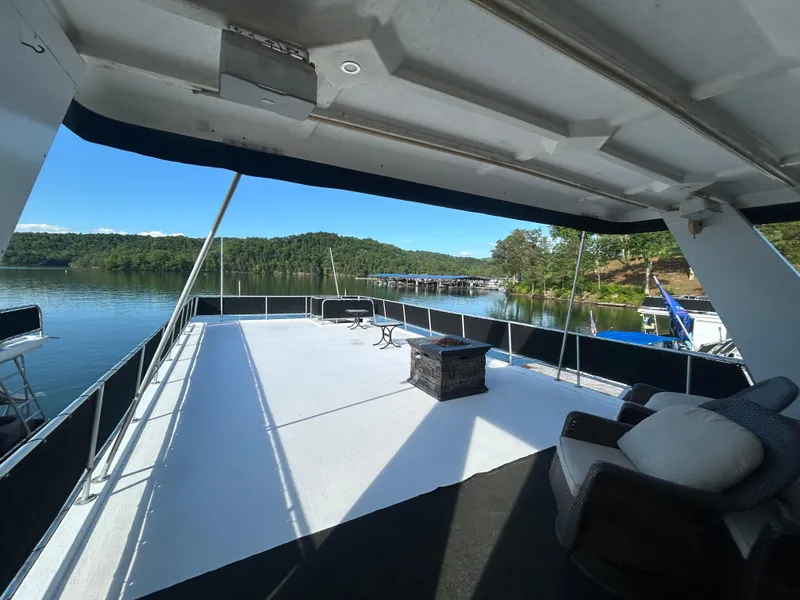 Slide: The Image of Spacious deck of a 2001 Fantasy houseboat with scenic lake view. - 31