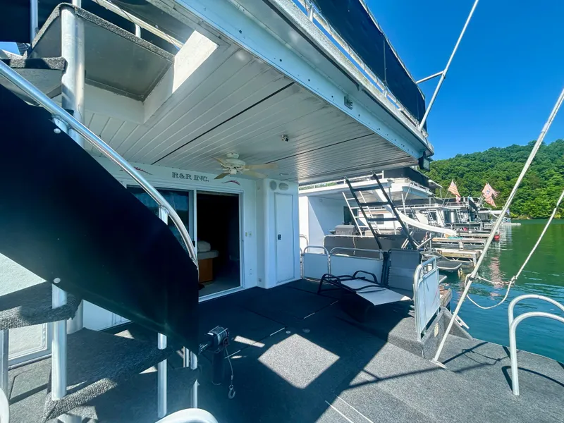 Slide: The Image of Fantasy houseboat with spiral staircase, outdoor seating, and lake view, model year 2001. - 32