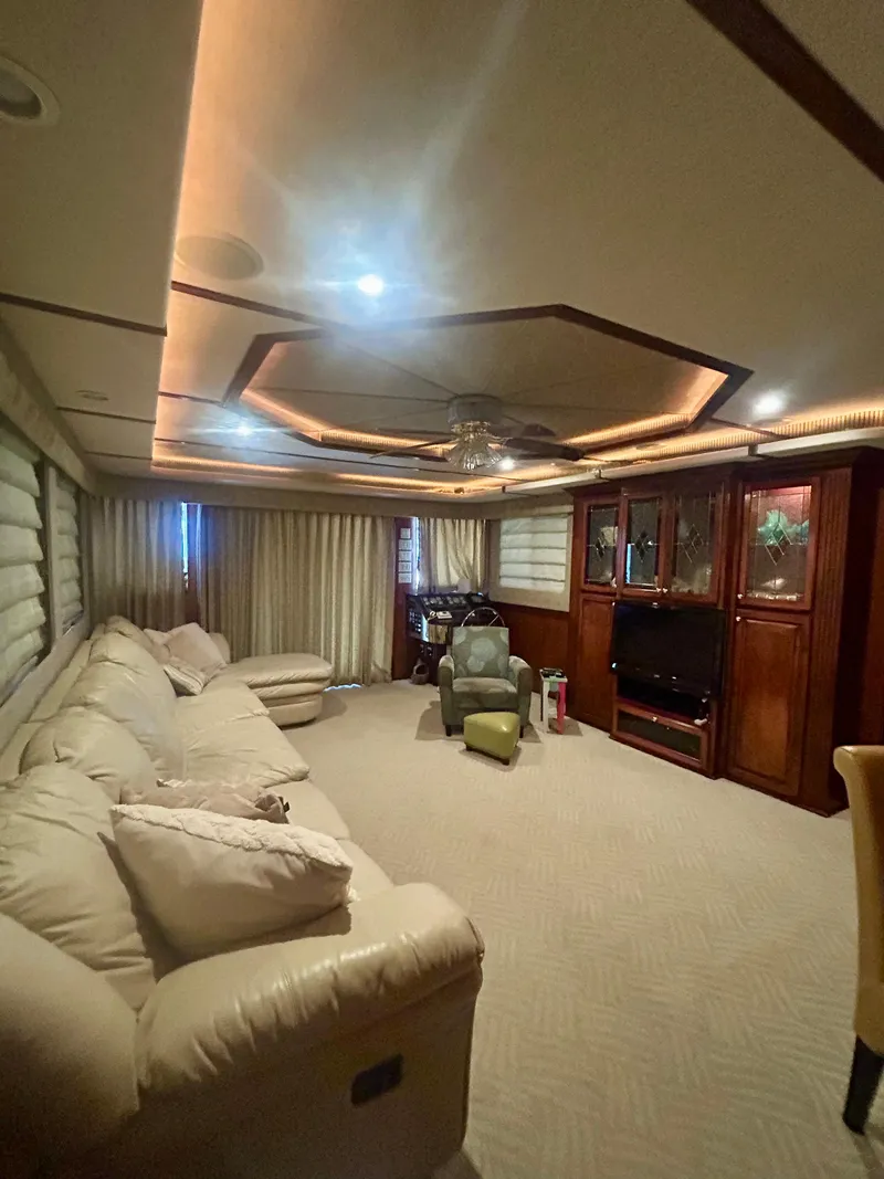 Slide: The Image of Luxurious 2001 Fantasy houseboat interior with plush seating and entertainment center. - 5