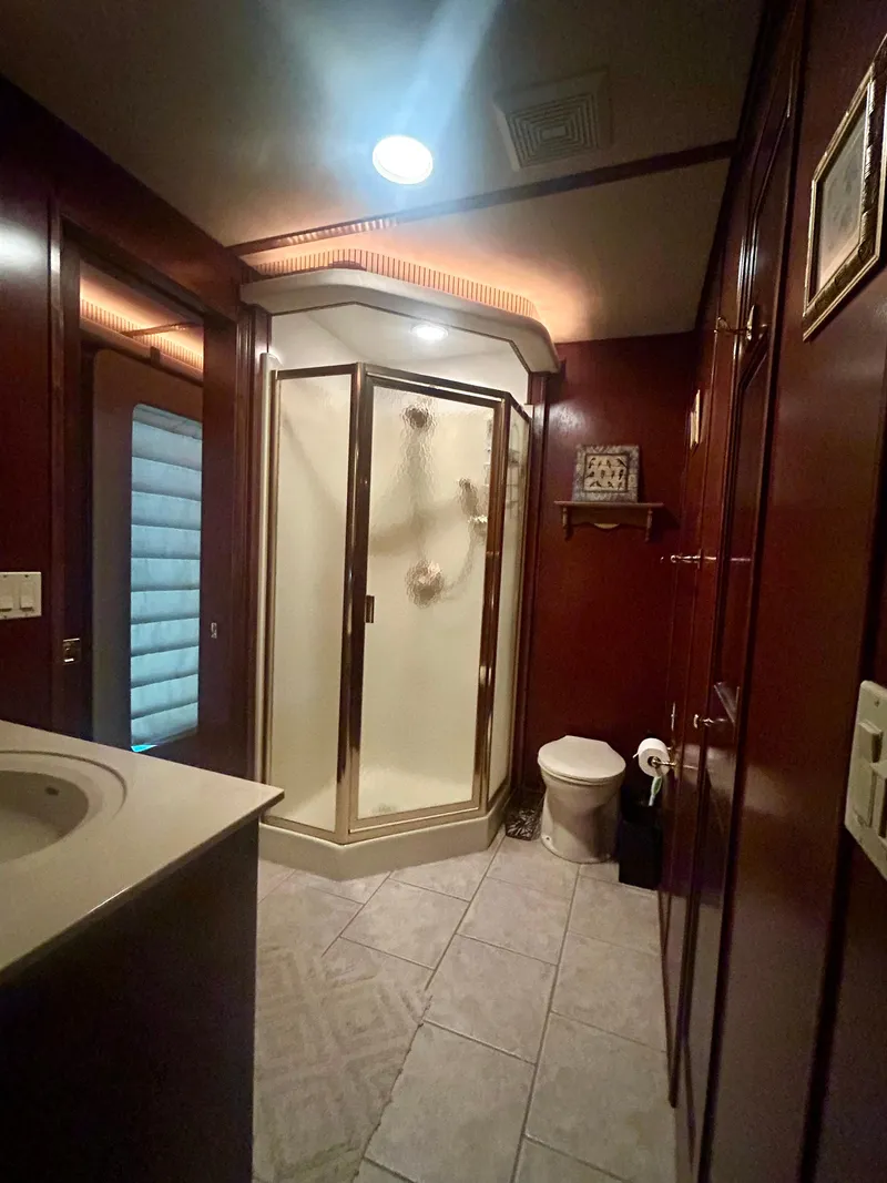 Slide: The Image of Luxurious houseboat bathroom with shower, toilet, and wooden cabinetry, Fantasy model, 2001. - 7