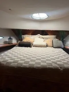 Slide: The Image of 2001 Silverton 410 Sport Bridge yacht docked at marina under clear blue sky. - 7