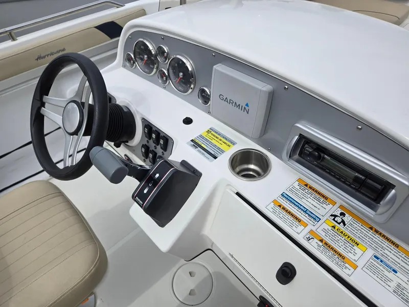 Slide: The Image of 2016 Godfrey Hurricane Sundeck SS211 Center Console dashboard with Garmin navigation system. - 11
