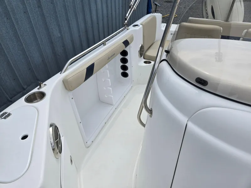 Slide: The Image of 2016 Godfrey Hurricane Sundeck SS211 Center Console boat interior with seating and storage. - 18