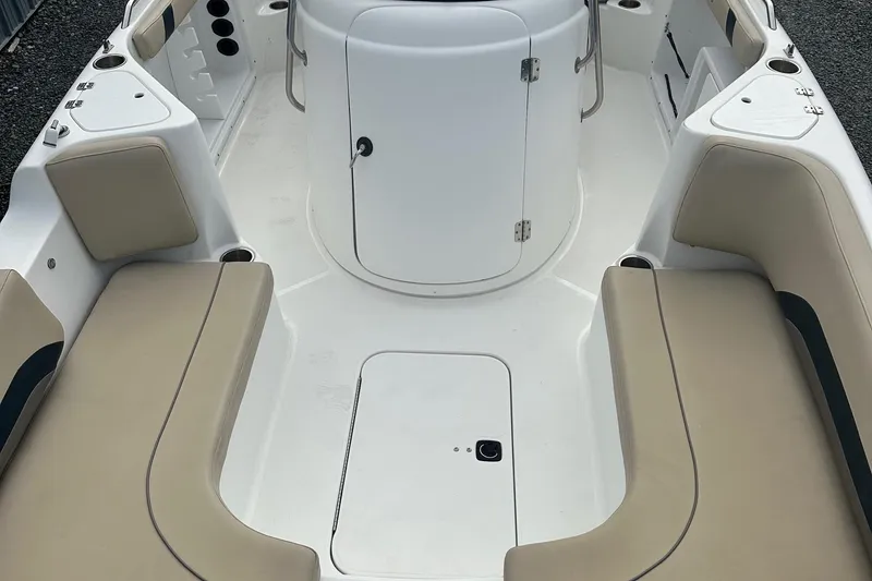 Slide: The Image of 2016 Godfrey Hurricane Sundeck SS211 Center Console with beige seating and white deck. - 21