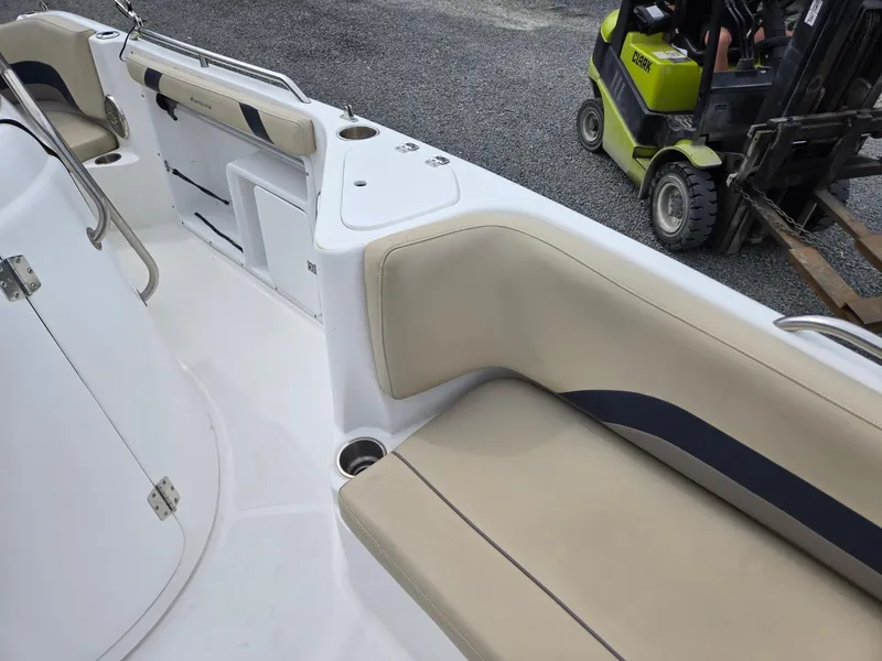 Slide: The Image of 2016 Godfrey Hurricane Sundeck SS211 Center Console with beige seating and cup holders. - 25