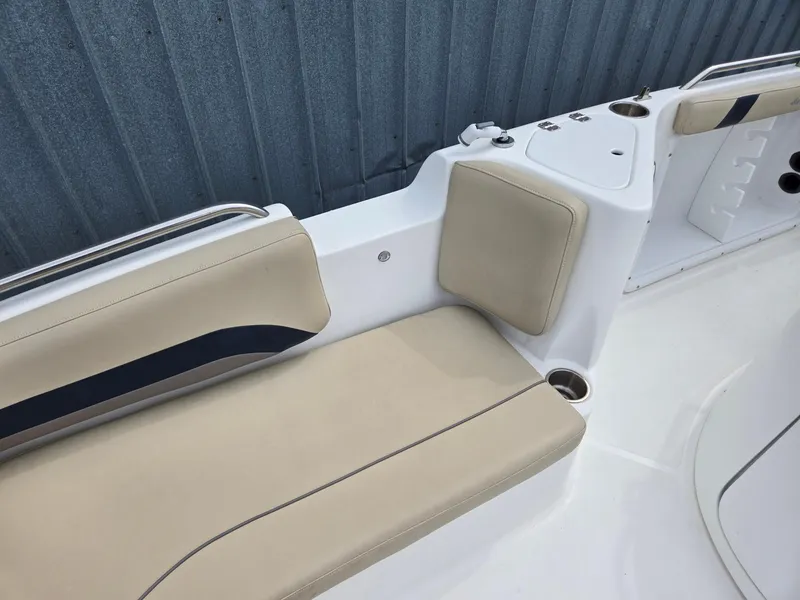 Slide: The Image of 2016 Godfrey Hurricane Sundeck SS211 Center Console boat seating with beige cushions. - 26