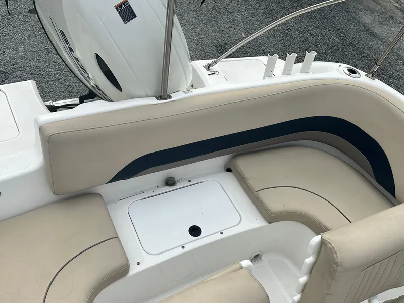 Slide: The Image of 2016 Godfrey Hurricane Sundeck SS211 Center Console boat interior with beige seating. - 30