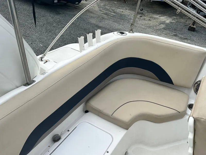 Slide: The Image of 2016 Godfrey Hurricane Sundeck SS211 Center Console boat seating area with beige upholstery. - 31