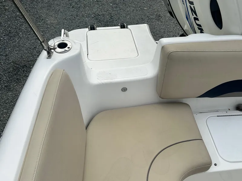 Slide: The Image of 2016 Godfrey Hurricane Sundeck SS211 Center Console boat interior with beige seating. - 32