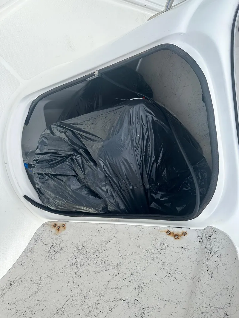 Slide: The Image of Storage compartment of 2016 Godfrey Hurricane Sundeck SS211 Center Console boat. - 33