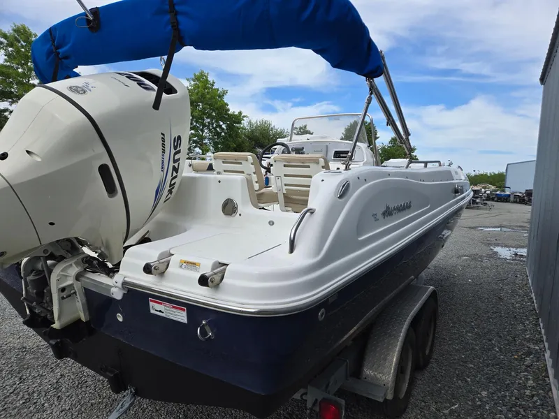 Slide: The Image of 2016 Godfrey Hurricane Sundeck SS211 Center Console boat with Suzuki outboard motor. - 6