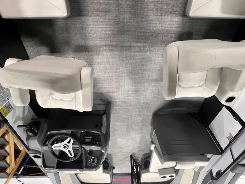 Slide: The Image of 2025 Sylvan A-Series A20 LZ DH boat interior with modern seating and steering console. - 10