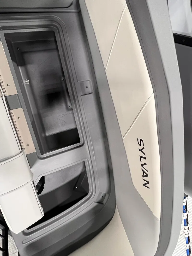 Slide: The Image of Interior of 2025 Sylvan A-Series A20 LZ DH boat, featuring sleek design and storage compartments. - 11