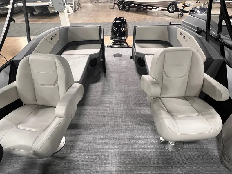 Slide: The Image of 2025 Sylvan A-Series A20 LZ DH boat interior with plush seating and modern design. - 15