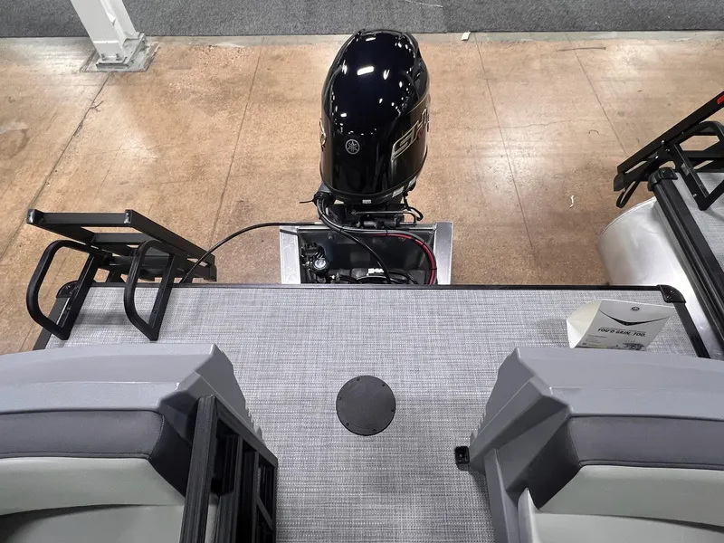 Slide: The Image of 2025 Sylvan A-Series A20 LZ DH boat with outboard motor, rear deck view. - 17