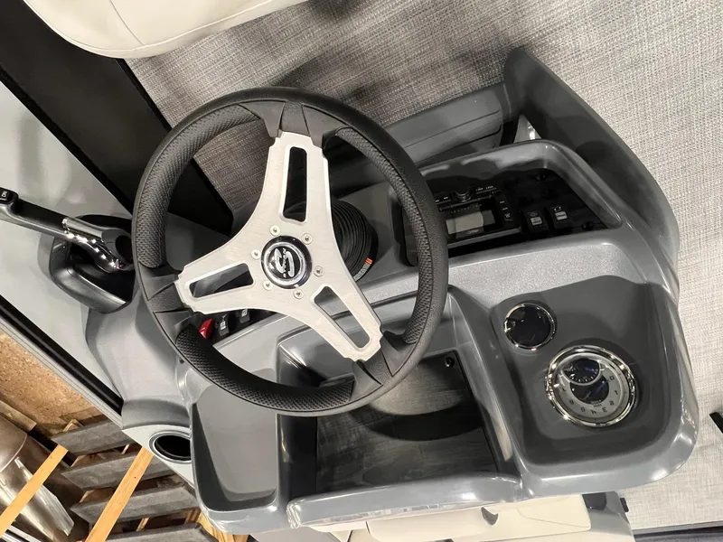 Slide: The Image of Steering console of 2025 Sylvan A-Series A20 LZ DH boat, featuring modern controls. - 19