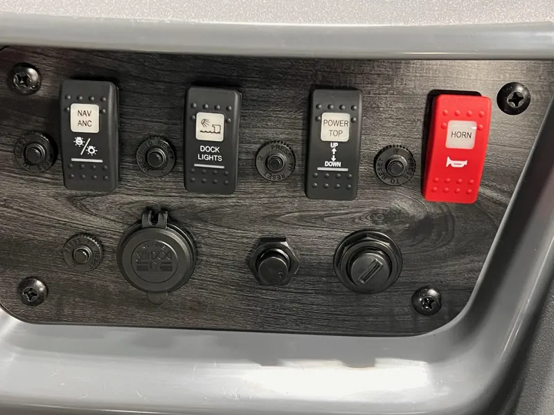 Slide: The Image of Control panel of 2025 Sylvan A-Series A20 LZ DH with switches for navigation, lights, and horn. - 23