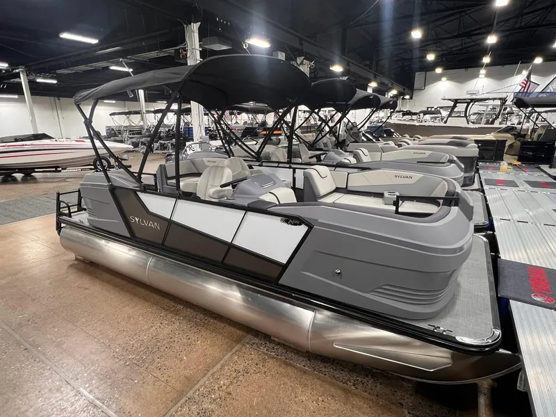 Slide: The Image of 2025 Sylvan A-Series A20 LZ DH pontoon boat displayed in a showroom. - 24