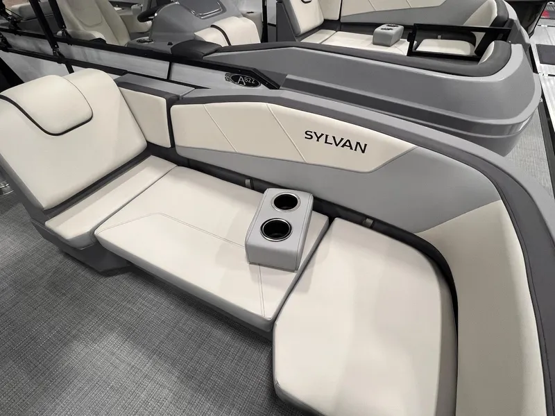 Slide: The Image of Luxurious seating in 2025 Sylvan A-Series A20 LZ DH boat, featuring cup holders and sleek design. - 26
