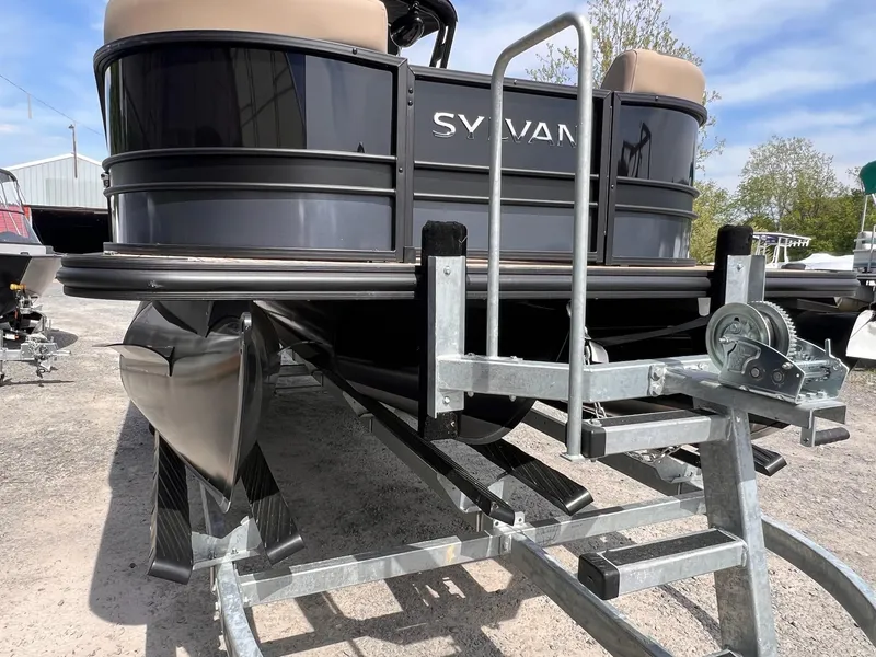 Slide: The Image of 2025 Sylvan L3 CLZ DH WT pontoon boat on trailer, outdoor setting. - 14