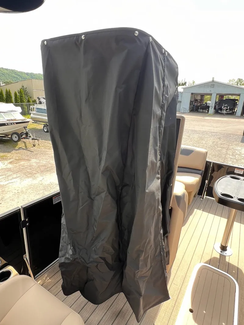 Slide: The Image of 2025 Sylvan L3 CLZ DH WT boat with black cover on deck. - 16