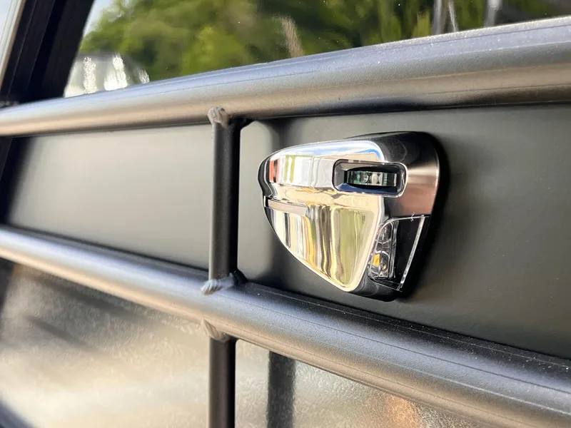 Slide: The Image of Close-up of 2025 Sylvan L3 CLZ DH WT boat detail, featuring sleek chrome hardware. - 18