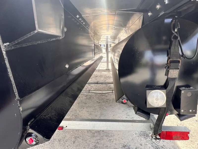 Slide: The Image of Underneath view of a 2025 Sylvan L3 CLZ DH WT boat trailer. - 19