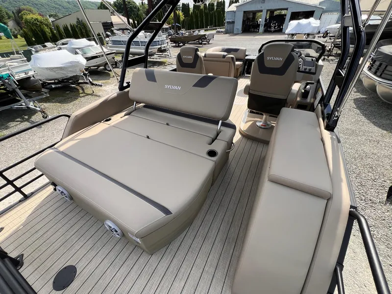 Slide: The Image of 2025 Sylvan L3 CLZ DH WT pontoon boat interior with beige seating and modern design. - 29