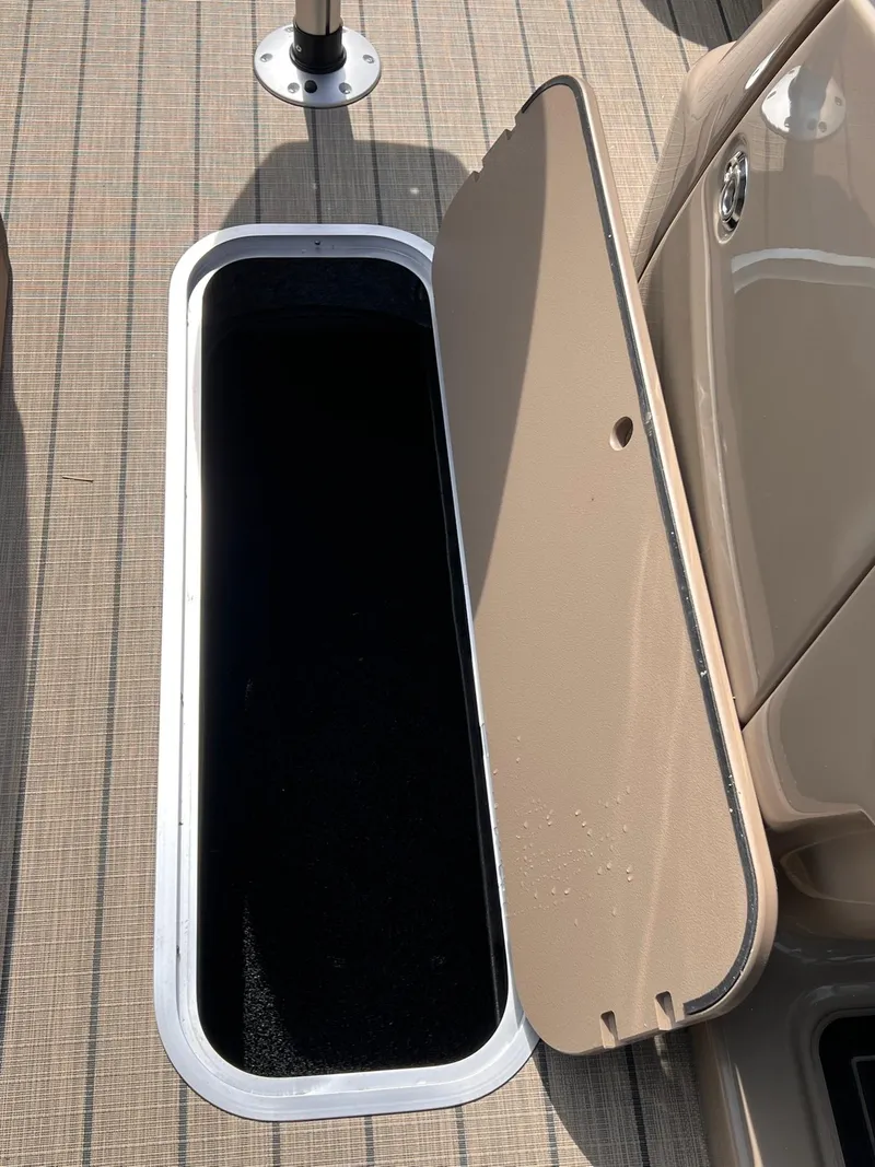 Slide: The Image of Open storage compartment on 2025 Sylvan L3 CLZ DH WT boat deck. - 31