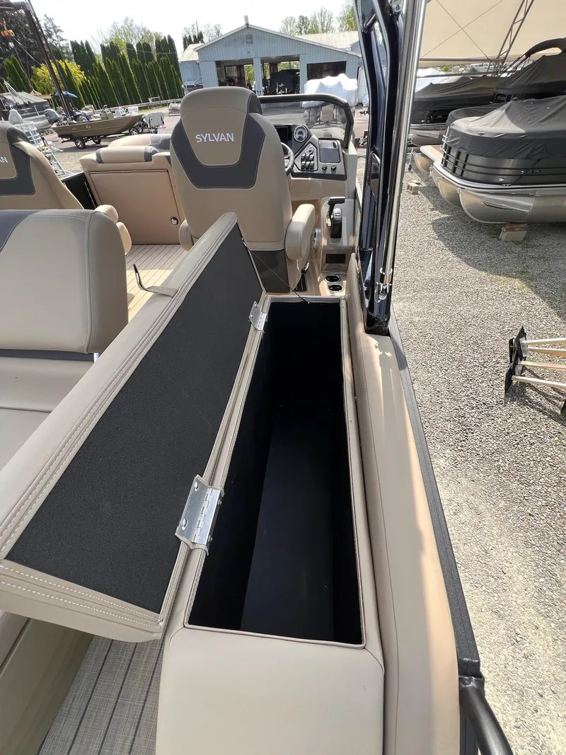 Slide: The Image of 2025 Sylvan L3 CLZ DH WT boat interior with open storage compartment. - 40