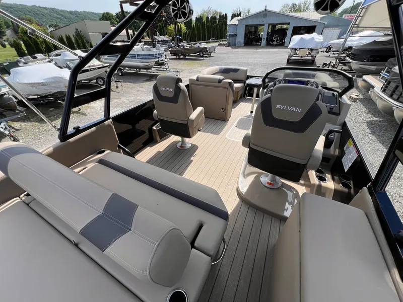 Slide: The Image of Interior of 2025 Sylvan L3 CLZ DH WT pontoon boat with modern seating and controls. - 6