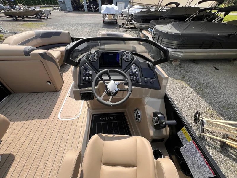 Slide: The Image of Interior of 2025 Sylvan L3 CLZ DH WT boat with modern dashboard and steering wheel. - 7