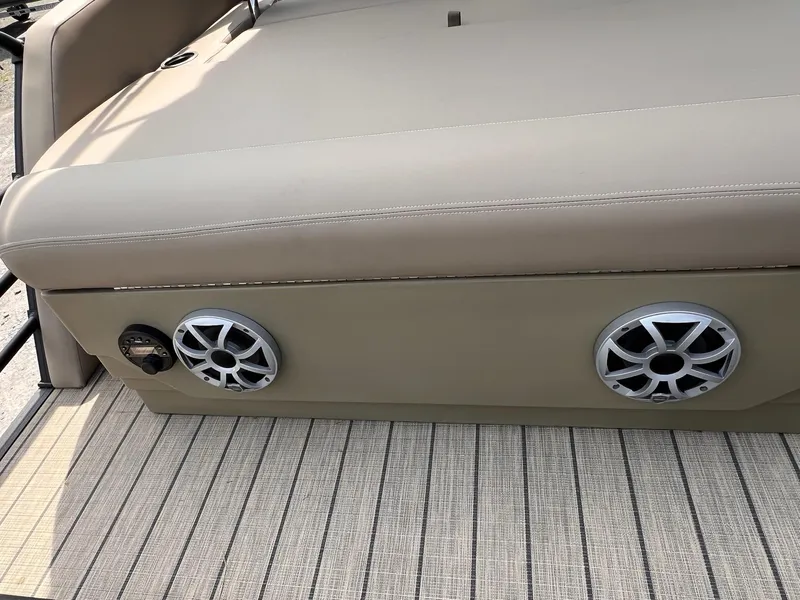 Slide: The Image of Beige seating with speakers on a 2025 Sylvan L3 CLZ DH WT boat. - 9