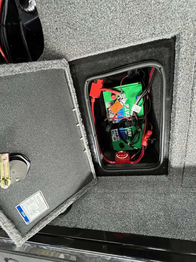 Slide: The Image of 2023 Tracker TARGA V-19 WT TE battery compartment with wiring and connections. - 10